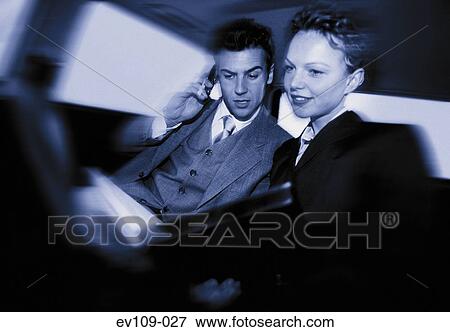 Business couple in car View Large Photo Image Stock Photo - Business couple in car. Fotosearch