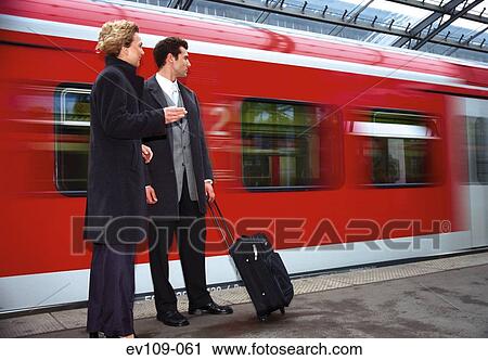 Business couple on platform View Large Photo Image Stock Image - Business couple on platform. Fotosearch