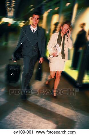 Business couple on the move View Large Photo Image Stock Image - Business couple on the move. Fotosearch