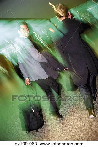 Business couple on the move View Large Photo Image Stock Photo - Business couple on the move. Fotosearch