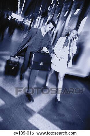 Business couple on the move View Large Photo Image Stock Photography - Business couple on the move. Fotosearch