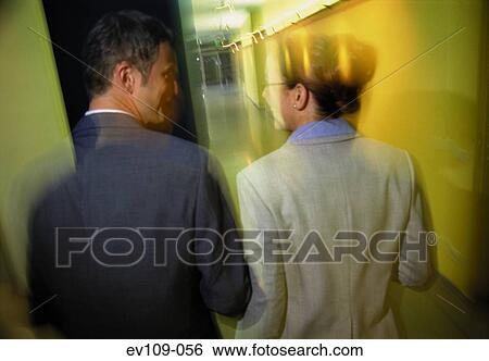 Stock Photograph - Business couple talking. Fotosearch