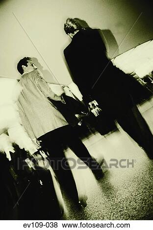 Stock Photo - Business couple walking. Fotosearch