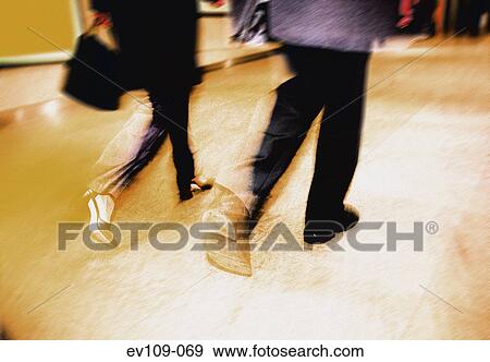Business couple walking View Large Photo Image Stock Photo - Business couple walking. Fotosearch