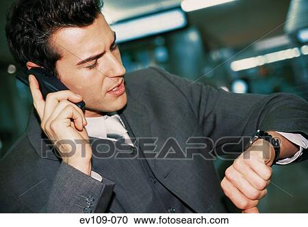 Stock Image - Businessman on phone. Fotosearch
