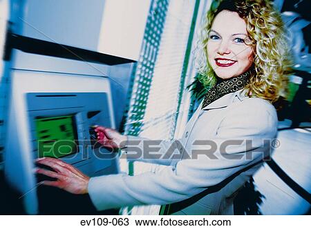 Woman withdrawing cash View Large Photo Image Stock Image - Woman withdrawing cash. Fotosearch
