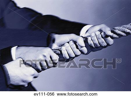 Stock Photograph - Men tugging rope. Fotosearch