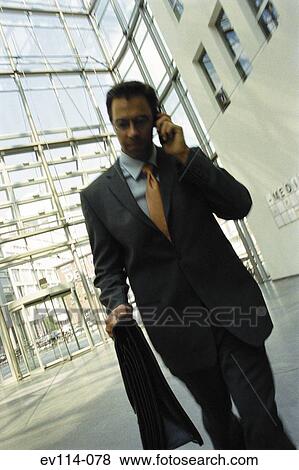 Stock Photo - Businessman on mobile phone. Fotosearch