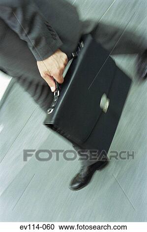 Stock Image - Businessman walking. Fotosearch