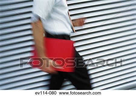 Man carrying file View Large Photo Image Stock Image - Man carrying file. Fotosearch