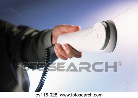 Stock Photo - Passing the phone. Fotosearch