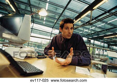Stock Photography - Businessman at his desk. Fotosearch