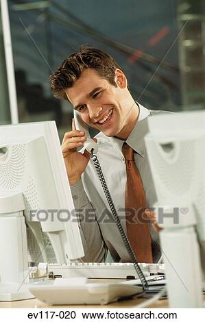 Stock Image - Businessman on phone. Fotosearch