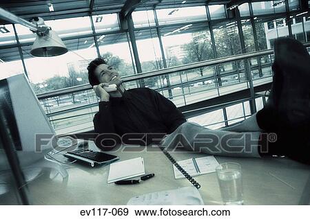 Stock Photo - Businessman on phone. Fotosearch