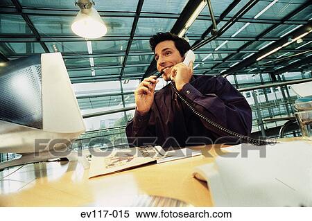 Stock Photography - Businessman on phone. Fotosearch