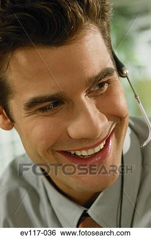 Stock Photograph - Man with headset. Fotosearch