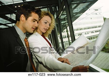 Stock Image - People discussing plan. Fotosearch