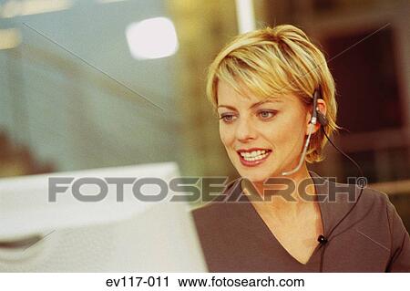 Woman with headset View Large Photo Image Stock Image - Woman with headset. Fotosearch