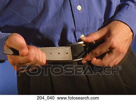 Stock Image - Tightening the belt. Fotosearch