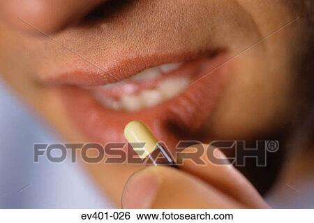 Taking medication View Large Photo Image Stock Photograph - Taking medication. Fotosearch