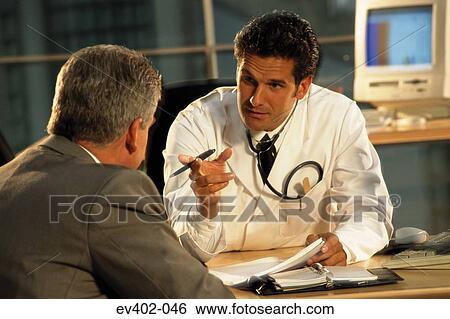 Stock Photograph - Medical consultation. Fotosearch