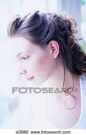 Stock Image - Woman at window. Fotosearch