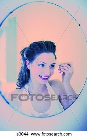 Woman in mirror View Large Photo Image Picture - Woman in mirror. Fotosearch