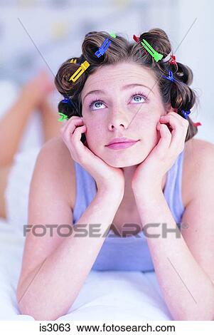 Woman with hairclips View Large Photo Image Stock Image - Woman with hairclips. Fotosearch
