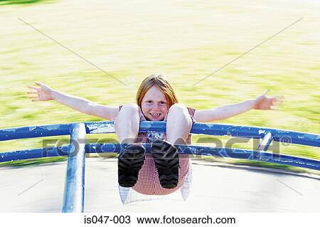 Girl on a roundabout View Large Photo Image Stock Image - Girl on a roundabout. Fotosearch