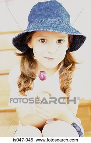 Girl wearing a summer hat View Large Photo Image Stock Photography - Girl wearing a summer hat . Fotosearch