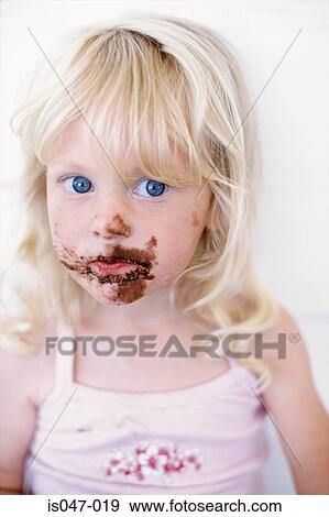 Stock Photo - Girl with chocolate on her face . Fotosearch
