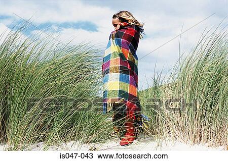 Stock Image - Girl wrapped in a blanket. Fotosearch