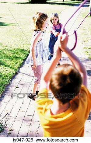 Kids in a playground View Large Photo Image Stock Photograph - Kids in a playground. Fotosearch