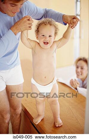 Stock Photography - Baby's first steps. Fotosearch