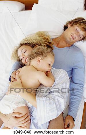 Family in bed View Large Photo Image Stock Image - Family in bed. Fotosearch