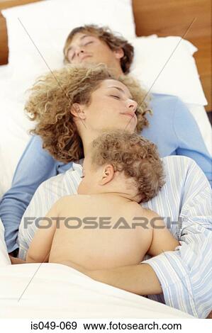 Family in bed View Large Photo Image Stock Photo - Family in bed. Fotosearch
