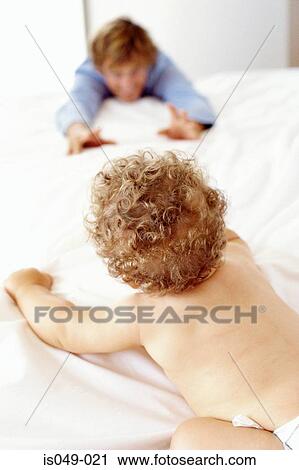Father and child in bed View Large Photo Image Stock Image - Father and child in bed. Fotosearch