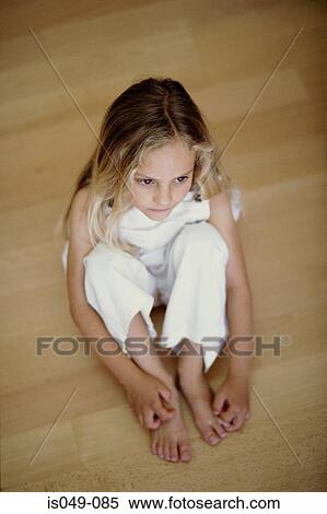 Girl seated on the floor View Large Photo Image Stock Photography - Girl seated on the floor. Fotosearch