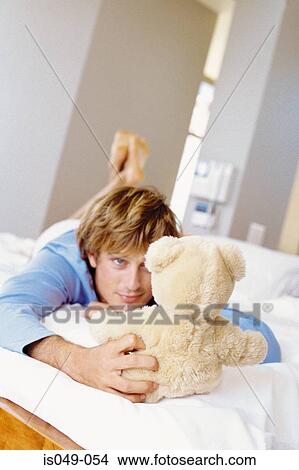 Man with a teddy bear View Large Photo Image Picture - Man with a teddy bear. Fotosearch