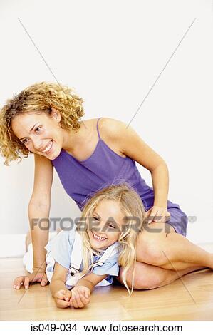 Mother and daughter having fun View Large Photo Image Picture - Mother and daughter having fun. Fotosearch