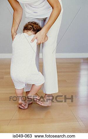 Toddler's first steps View Large Photo Image Stock Image - Toddler's first steps. Fotosearch