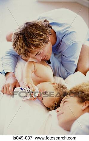 Young couple with baby View Large Photo Image Stock Photo - Young couple with baby . Fotosearch