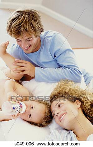 Stock Photograph - Young couple with baby . Fotosearch