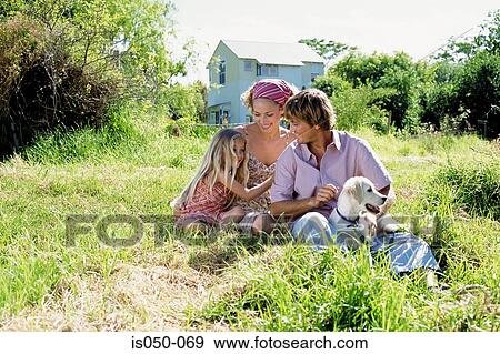 Family chilling out in the sun View Large Photo Image Stock Photo - Family chilling out in the sun. Fotosearch