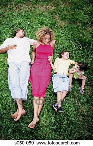 Family day out in a park View Large Photo Image Stock Photo - Family day out in a park . Fotosearch