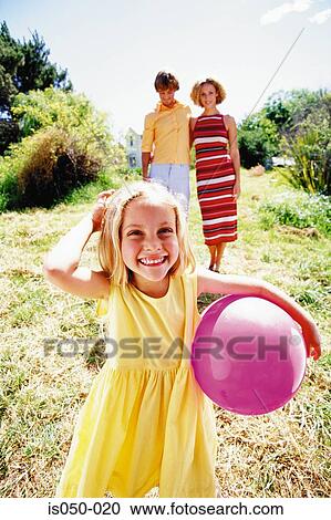 Girl holding ball View Large Photo Image Stock Image - Girl holding ball. Fotosearch