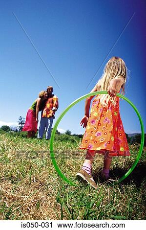 Girl with hula hoop View Large Photo Image Stock Image - Girl with hula hoop. Fotosearch