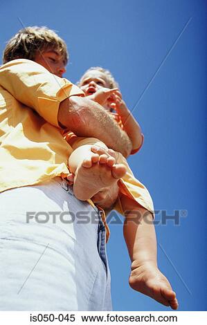 Stock Photography - Man holding baby. Fotosearch