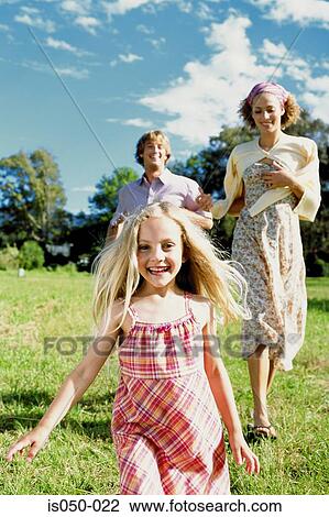 Parents playing with daughter View Large Photo Image Stock Image - Parents playing with daughter. Fotosearch