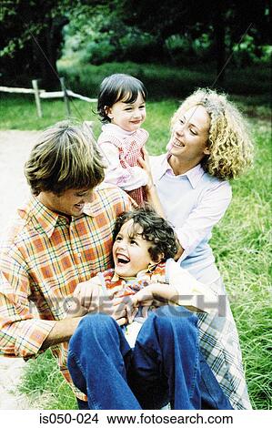 Parents playing with kids View Large Photo Image Picture - Parents playing with kids. Fotosearch